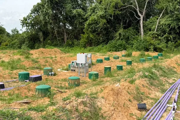 Septic drip dispersal field with control panel and green risers