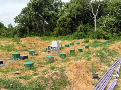 Septic drip dispersal field with control panel and green risers