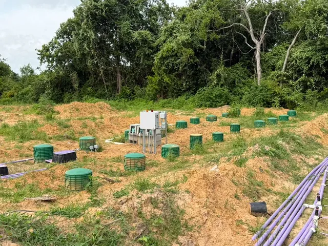 Septic drip dispersal field with control panel and green risers
